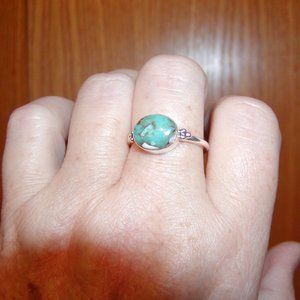 Turquoise ring.